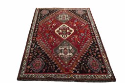Surface texture of 2000s Shiraz rug with natural Wool and intricate pattern