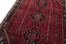 Backside of handmade 2000s Shiraz rug showing knot structure and weave density