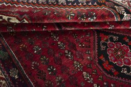 Full view of 2000s Shiraz rug from Iran / Persia, 280 × 172 cm in Red tones