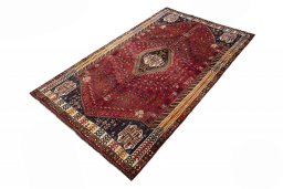 Corner detail of 2000s Shiraz rug showing border pattern and Wool pile