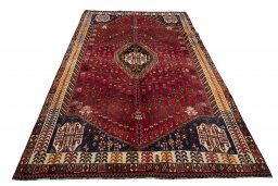 Surface texture of 2000s Shiraz rug with natural Wool and intricate pattern