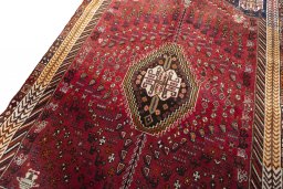 Backside of handmade 2000s Shiraz rug showing knot structure and weave density