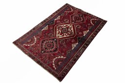 Corner detail of 2000s Shiraz rug showing border pattern and Wool pile