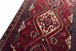 Backside of handmade 2000s Shiraz rug showing knot structure and weave density