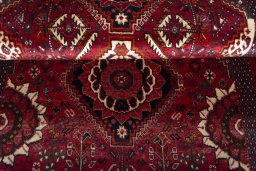 Full view of 2000s Shiraz rug from Iran / Persia, 172 × 115 cm in Red tones
