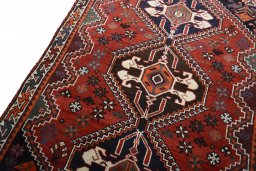 Backside of handmade 2000s Shiraz rug showing knot structure and weave density