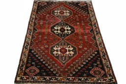Surface texture of 2000s Shiraz rug with natural Wool and intricate pattern
