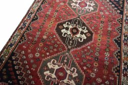 Backside of handmade 2000s Shiraz rug showing knot structure and weave density