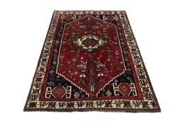 Surface texture of 2000s Shiraz rug with natural Wool and intricate pattern