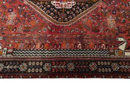 Corner detail of 2000s Shiraz rug showing border pattern and Wool pile