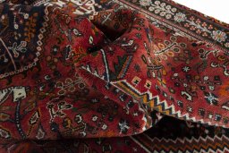 Surface texture of 2000s Shiraz rug with natural Wool and intricate pattern