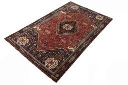 Corner detail of 2000s Shiraz rug showing border pattern and Wool pile