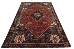Surface texture of 2000s Shiraz rug with natural Wool and intricate pattern