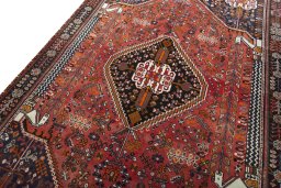 Backside of handmade 2000s Shiraz rug showing knot structure and weave density