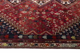 Corner detail of 2000s Shiraz rug showing border pattern and Wool pile