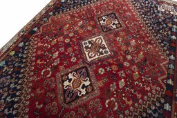 Backside of handmade 2000s Shiraz rug showing knot structure and weave density