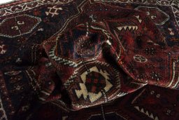Corner detail of 2000s Shiraz rug showing border pattern and Wool pile