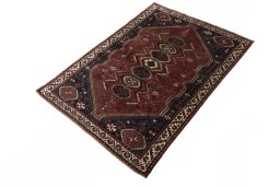 Corner detail of 2000s Shiraz rug showing border pattern and Wool pile