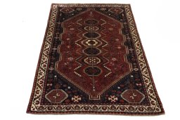 Surface texture of 2000s Shiraz rug with natural Wool and intricate pattern