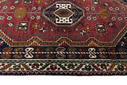 Corner detail of 2000s Shiraz rug showing border pattern and Wool pile