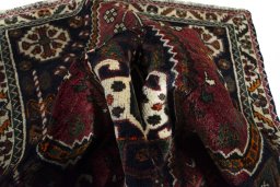 Surface texture of 2000s Shiraz rug with natural Wool and intricate pattern