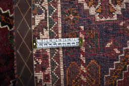 Backside of handmade 2000s Shiraz rug showing knot structure and weave density