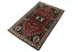 Corner detail of 2000s Shiraz rug showing border pattern and Wool pile