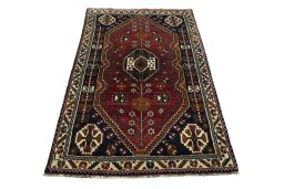 Surface texture of 2000s Shiraz rug with natural Wool and intricate pattern