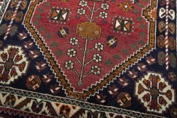Close-up detail of 2000s Shiraz rug from Iran / Persia showing Wool weave