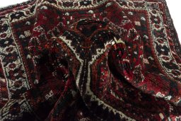 Corner detail of 2000s Shiraz rug showing border pattern and Wool pile