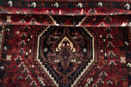 Full view of 2000s Shiraz rug from Iran / Persia, 165 × 112 cm in Red tones