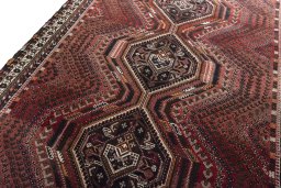 Backside of handmade 2000s Shiraz rug showing knot structure and weave density