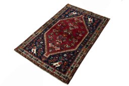 Corner detail of 2000s Shiraz rug showing border pattern and Wool pile
