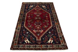 Surface texture of 2000s Shiraz rug with natural Wool and intricate pattern