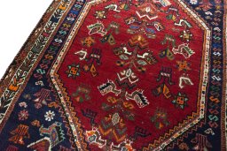 Backside of handmade 2000s Shiraz rug showing knot structure and weave density