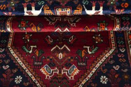 Full view of 2000s Shiraz rug from Iran / Persia, 167 × 107 cm in Red tones