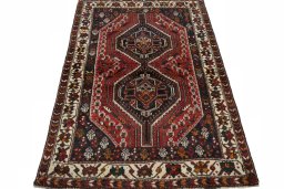 Surface texture of 2000s Shiraz rug with natural Wool and intricate pattern