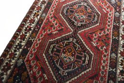 Backside of handmade 2000s Shiraz rug showing knot structure and weave density