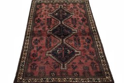 Surface texture of 2000s Shiraz rug with natural Wool and intricate pattern
