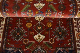 Backside of handmade 2000s Shiraz rug showing knot structure and weave density