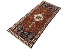 Corner detail of 2000s Shiraz rug showing border pattern and Wool pile