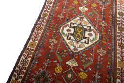 Backside of handmade 2000s Shiraz rug showing knot structure and weave density
