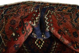 Corner detail of 2000s Shiraz rug showing border pattern and Wool pile