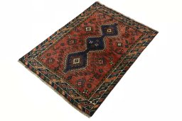 Corner detail of 2000s Shiraz rug showing border pattern and Wool pile