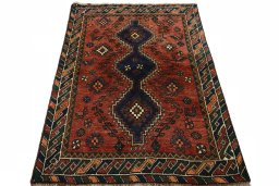 Surface texture of 2000s Shiraz rug with natural Wool and intricate pattern