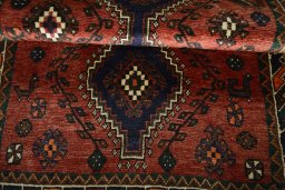 Full view of 2000s Shiraz rug from Iran / Persia, 151 × 105 cm in Red tones