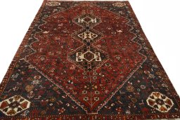 Surface texture of 2000s Shiraz rug with natural Wool and intricate pattern