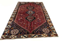 Surface texture of 2000s Shiraz rug with natural Wool and intricate pattern