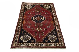 Surface texture of 2000s Shiraz rug with natural Wool and intricate pattern