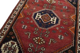 Backside of handmade 2000s Shiraz rug showing knot structure and weave density